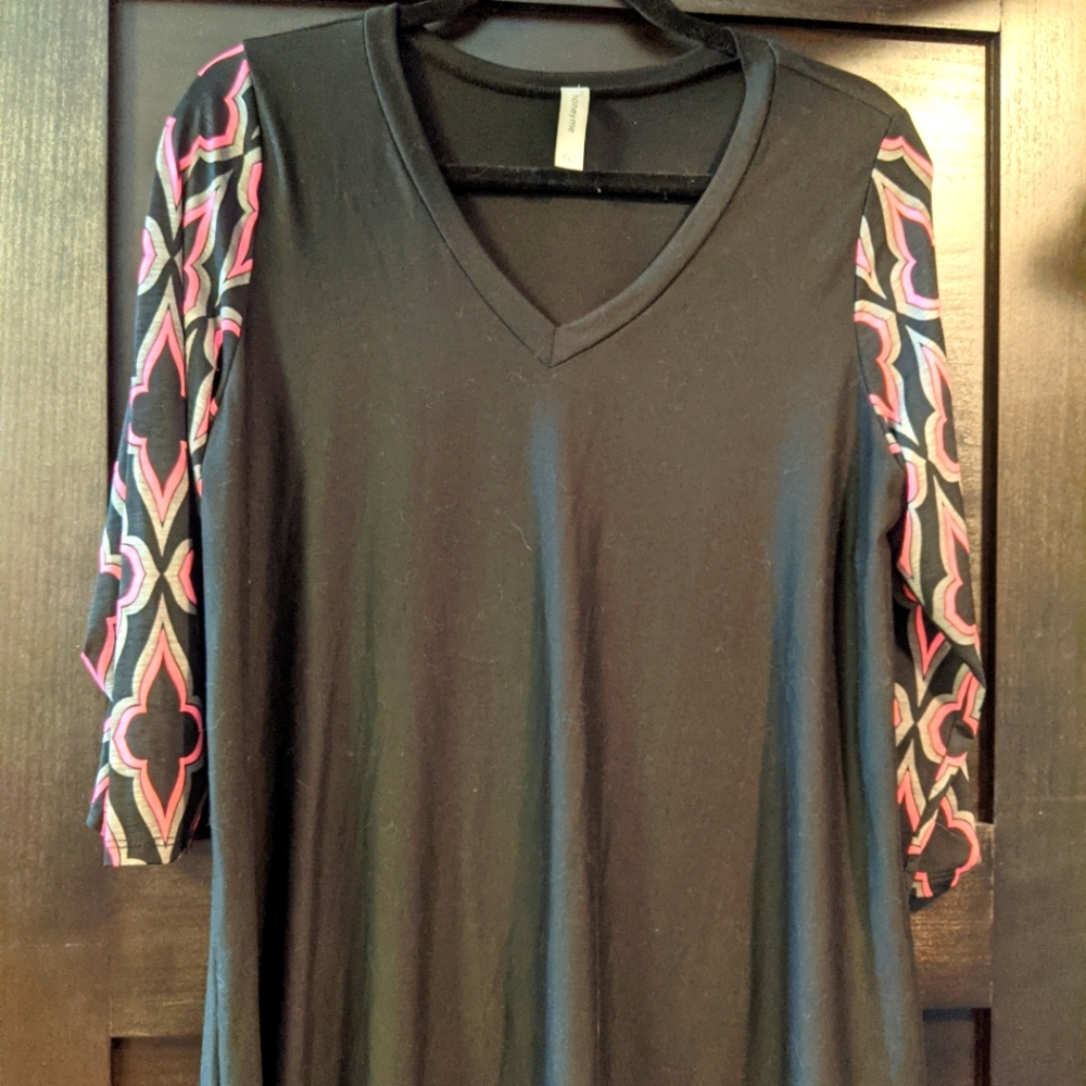Black V neck top with fun sleeves.